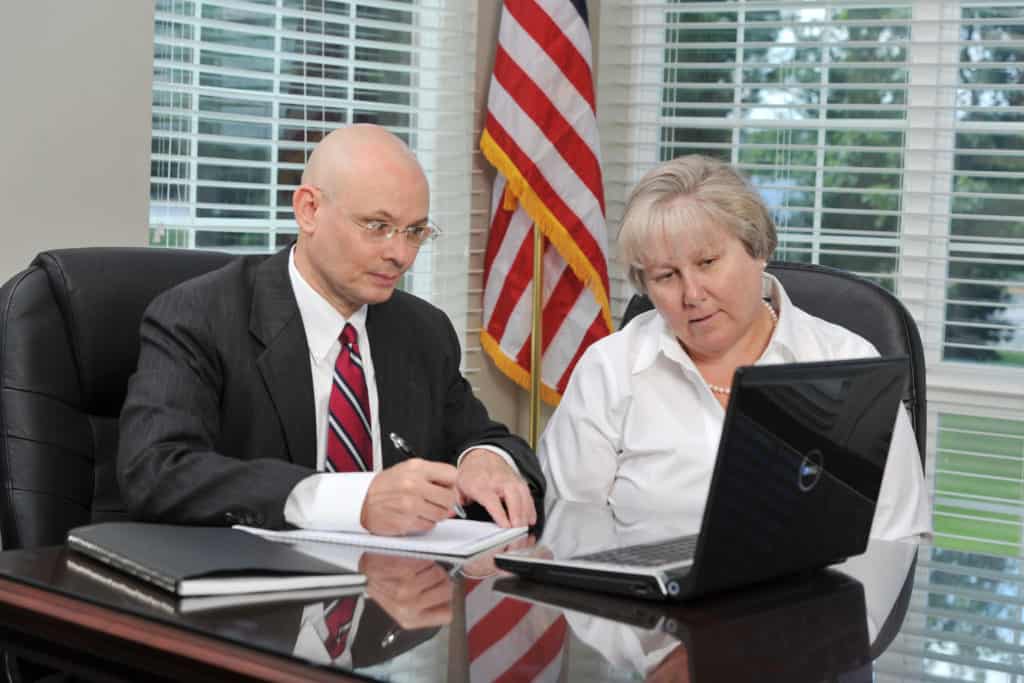 tom dunn and woman on computer together