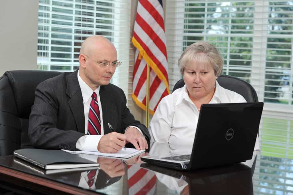 tom dunn and woman on computer together