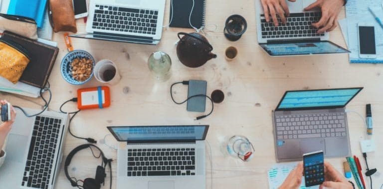 overhead view of laptops on a desk
