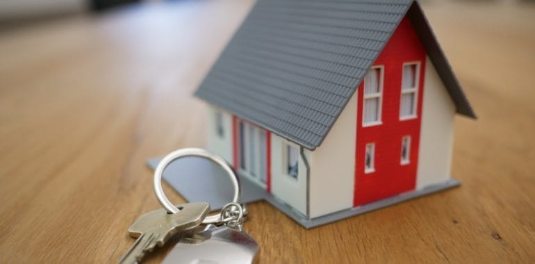 small model house near a key chain