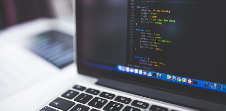 laptop displaying computer code