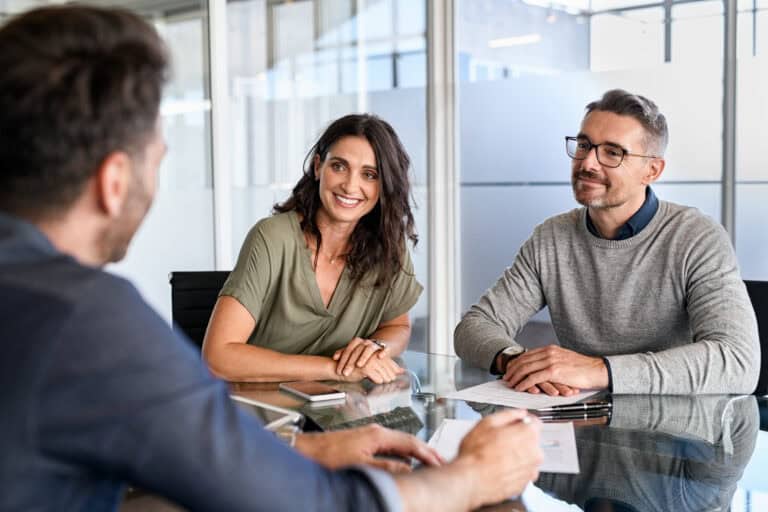 Business meeting with three participants.